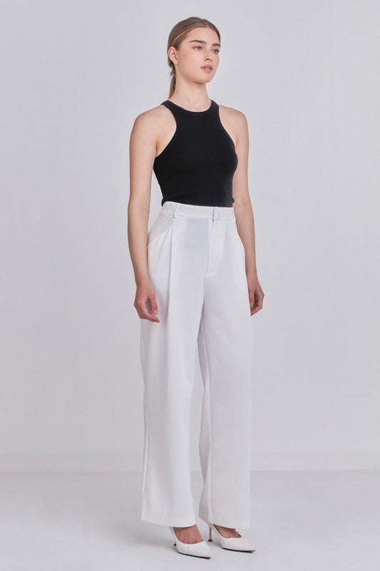 Black Sleeveless Knit Top and white pants